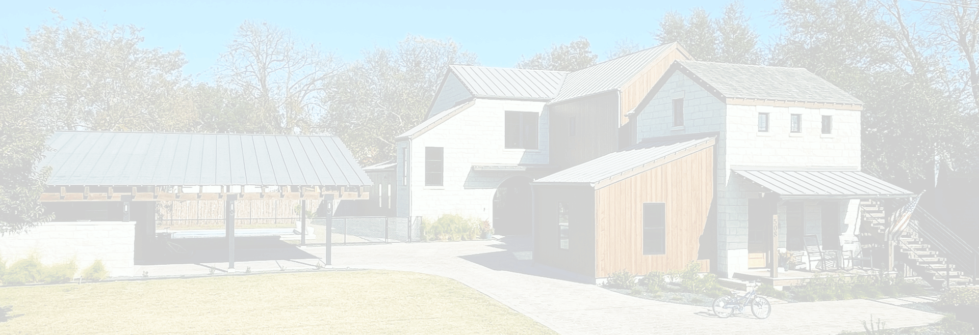 A home with a new metal roof and a covered carport.