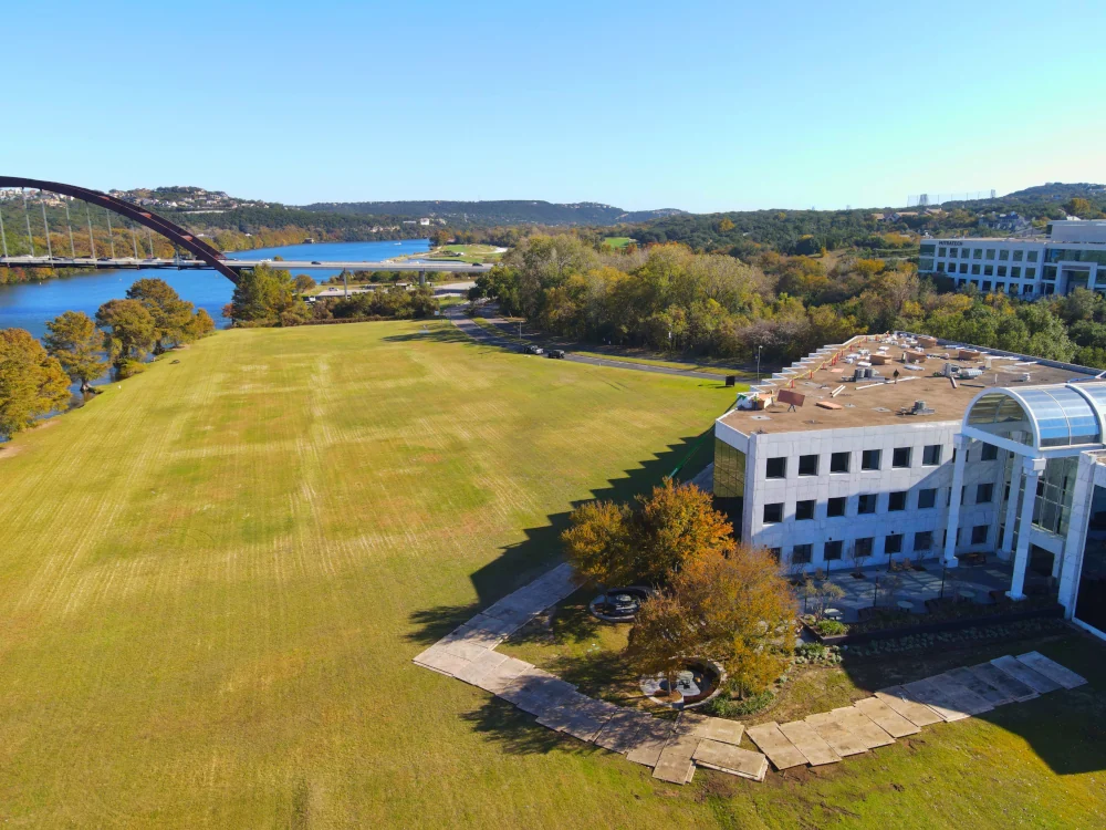 A drone image of a commercial roofing job with a crew from Texas Roof Repair.