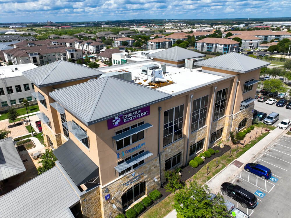 A new helath clinic commercial building with the roof installed by Texas Roof Repair.