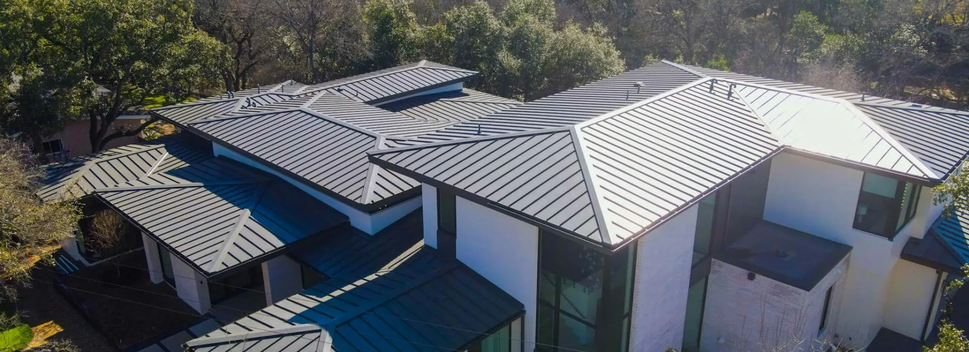 A home with a new metal roof installed by Texas Roof Repair.