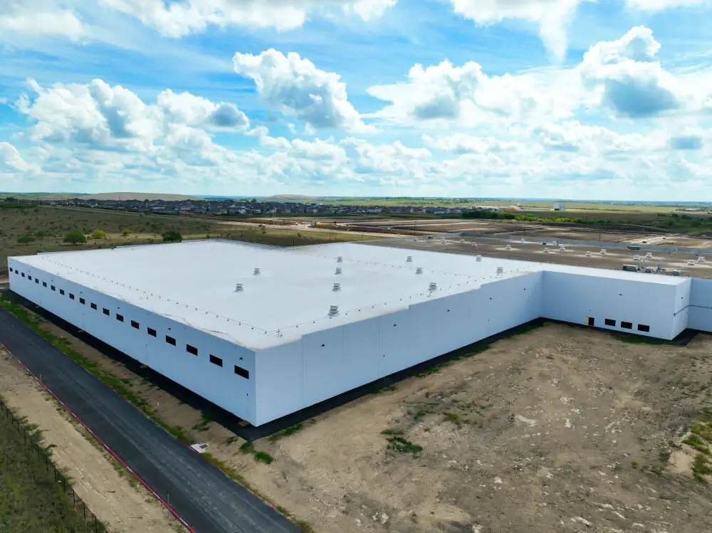 A large commercial building with the roof installed by Texas Roof Repair.