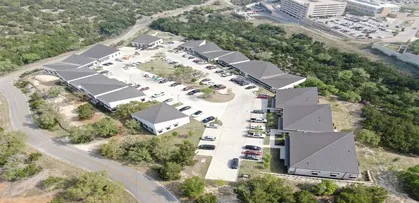 An aerial view of a new housing development with roof materials installed by Texas Roof Repair.